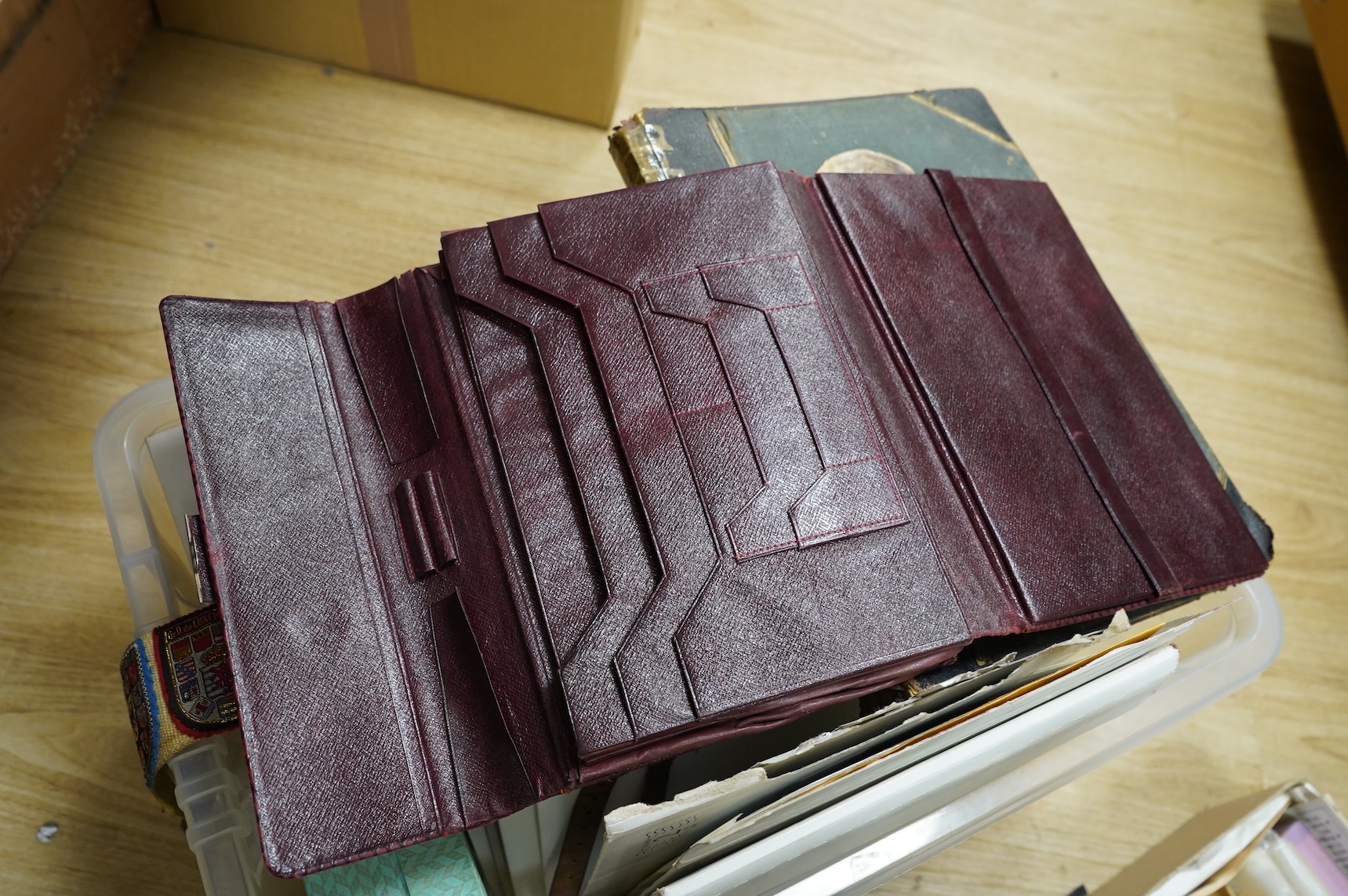 A collection of sundry items to include a scrapbook and a large collection of various stamps